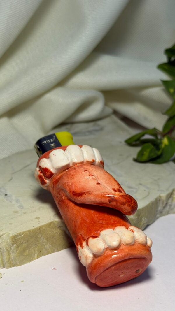 WhatsApp Image 2026-04-02 at 1.00.21 as Bloody Bite Lighter Sleeve