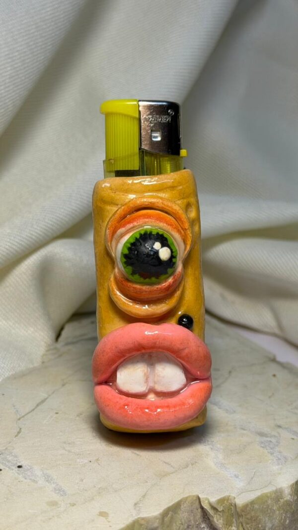 WhatsApp Image 2026-04-'at 1.00.18 PM One Eye Alien Lighter Sleeve